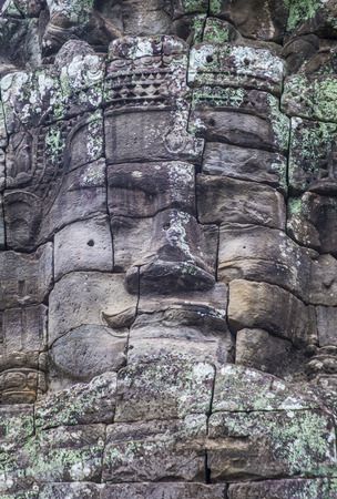 SIEM REAP , CAMBODIA - OCT 15 : Stone face at the bayon temple in Angkor Thom, Siem Reap Cambodia on October 15 2017 , Angkor Thom was the last and capital city of the Khmer empire.のeditorial素材