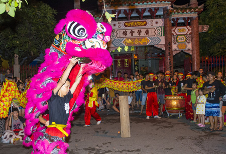 HOI AN , VIETNAM - OCT 04 : Participants in a Lion dance during the Mid autumn festiaval in Hoi An ,Vietnam on October 04 2017 this harvest festival celebrated by Chinese and Vietnameseのeditorial素材