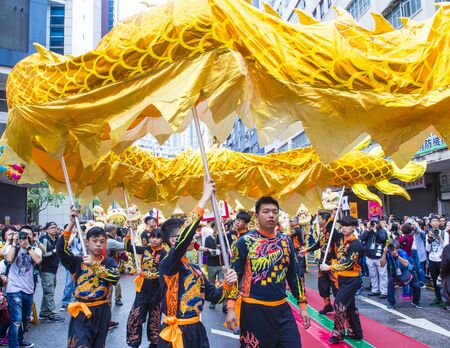 HONG KONG - MARCH 04 : Participants in the 14th Tai Kok Tsui temple fair in Hong Kong on March 04 2018. The temple fair is a Chinese cultural event held annuallyのeditorial素材