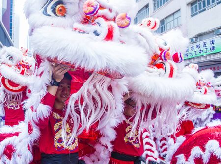 HONG KONG - MARCH 04 : Participants in the 14th Tai Kok Tsui temple fair in Hong Kong on March 04 2018. The temple fair is a Chinese cultural event held annuallyのeditorial素材