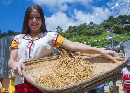BANAUE, PHILIPPINES - April 30 : Woman from Ifugao Minority in a rice pounding competion during Imbayah festival in Banaue the Philippines on April 30 2018.のeditorial素材