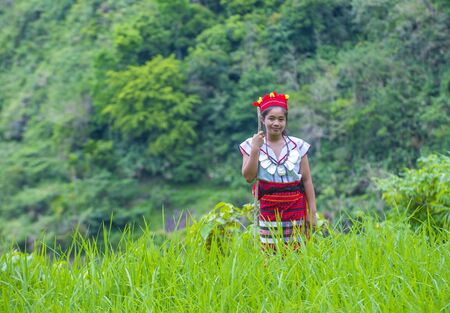 BANAUE, PHILIPPINES - MAY 02 : Woman from Ifugao Minority near a rice terraces in Banaue the Philippines on May 02 2018. The Ifugao minority mostly live in the mountains of north Philippinesのeditorial素材