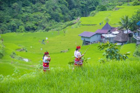 BANAUE, PHILIPPINES - MAY 02 : Women from Ifugao Minority near a rice terraces in Banaue the Philippines on May 02 2018. The Ifugao minority mostly live in the mountains of north Philippinesのeditorial素材