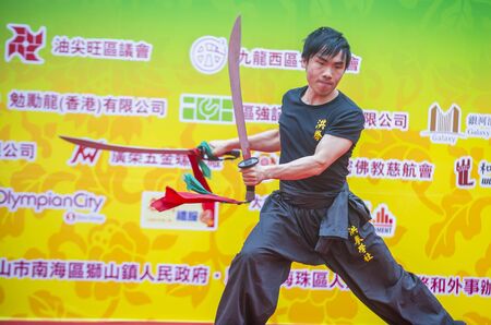 HONG KONG - MARCH 04 : Martial arts demonstration during the 14th Tai Kok Tsui temple fair in Hong Kong on March 04 2018. The temple fair is a Chinese cultural event held annuallyのeditorial素材