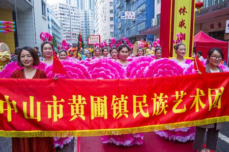 HONG KONG - MARCH 04 : Participants in the 14th Tai Kok Tsui temple fair in Hong Kong on March 04 2018. The temple fair is a Chinese cultural event held annuallyのeditorial素材