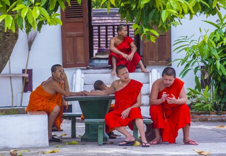 LUANG PRABANG , LAOS - AUG 12 2018 : Novice monks in Luang Prabang Laos on August 12 2018. It is estimated that about 1 in 3 male Laotians join a monastery at least for a whileのeditorial素材