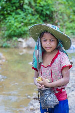 BAM PHOANSA AT , LAOS - AUG 14 : Laotian child from the village Bam Phoansa At , Laos on August 14 2018. nearly 70 percent of the population in Laos lives in villagesのeditorial素材