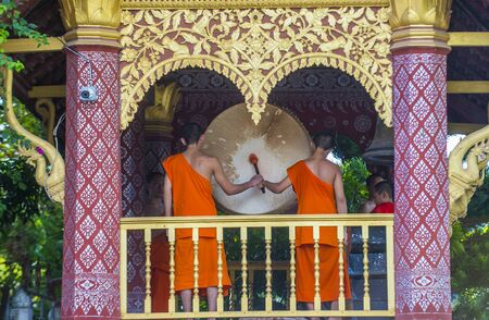 LUANG PRABANG , LAOS - AUG 12 2018 : Novice monks in Luang Prabang Laos on August 12 2018. It is estimated that about 1 in 3 male Laotians join a monastery at least for a whileのeditorial素材