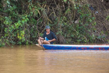 LUANG PRABANG , LAOS - AUG 12 : Laotian fisherman at the Mekong river in Luang Prabang Laos on August 12 2018 , The Mekong is one of the longest rivers of Asiaのeditorial素材