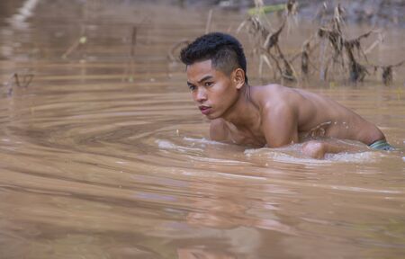 LUANG PRABANG , LAOS - AUG 12 : Laotian fisherman at the Mekong river in Luang Prabang Laos on...