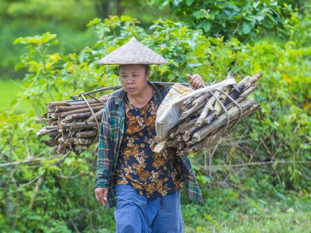 LUANG PRABANG , LAOS - AUG 14 : Laotian farmer in the countrside near Luang Prabang Laos on August 14 2018. nearly 70 percent of the population in Laos lives in villagesのeditorial素材