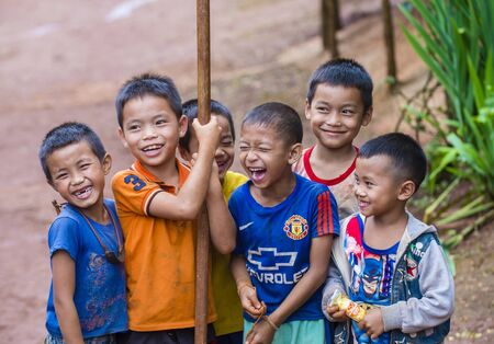 BAM PHOANSA AT , LAOS - AUG 14 : Laotian children from the village Bam Phoansa At , Laos on August 14 2018. nearly 70 percent of the population in Laos lives in villagesのeditorial素材