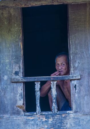 BAM PHOANSA AT , LAOS - AUG 14 : Laotian man from the village Bam Phoansa At , Laos on August 14 2018. nearly 70 percent of the population in Laos lives in villagesのeditorial素材