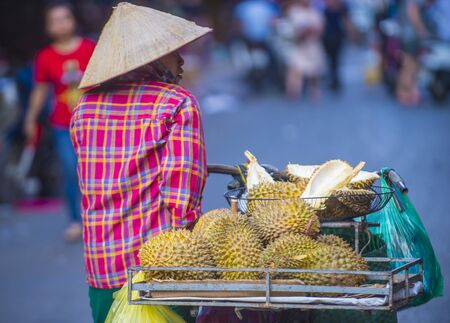 HANOI , VIETNAM - SEP 06 : Vendor in a market in Hanoi Vietnam on September 06 2018. Markets in...
