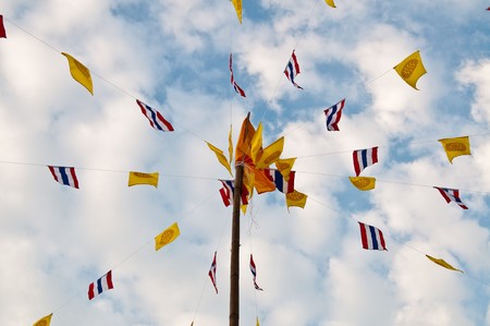 Buddhist  flag with pole, Thailand.の写真素材