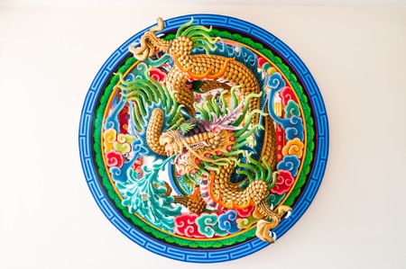 Dragon molding art on the wall, Thailand.の写真素材