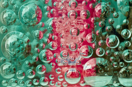 Green and pink color bubble in glass block, Thailand.の写真素材