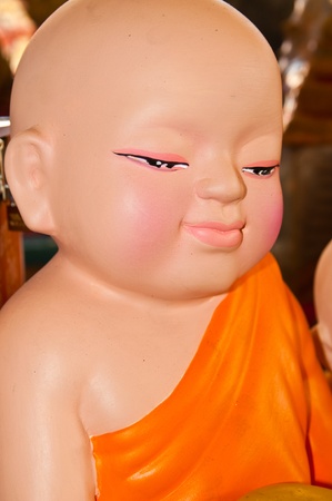 Novice ceramic doll in temple, Thailand.の写真素材