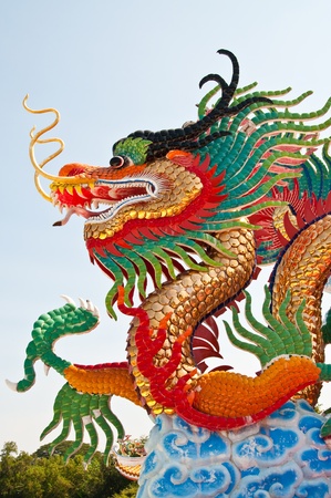 Colorful dragon statue with blue sky at public park, Thailand.の写真素材