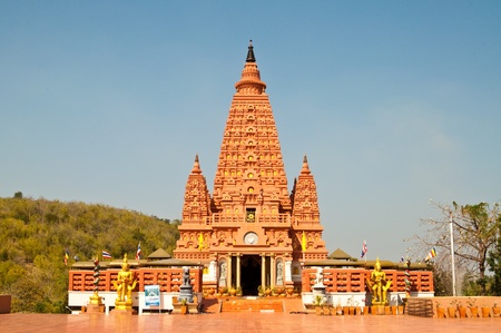 Beautiful orange pagoda with blue sky, Thailand.の写真素材