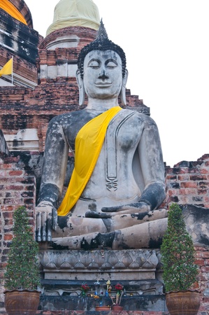 Gray buddha statue with white sky, Thailand.の写真素材