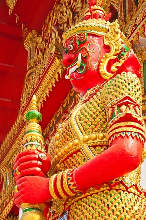Red giant and golden dress, Thailand.の写真素材
