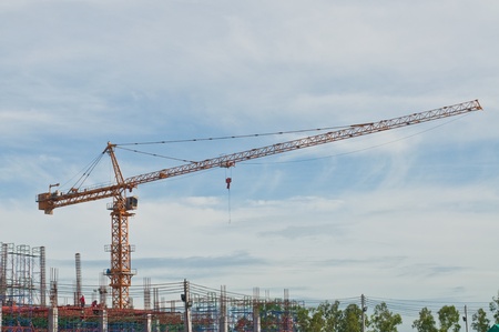 Tower crane with scaffolding, Thailand.の写真素材