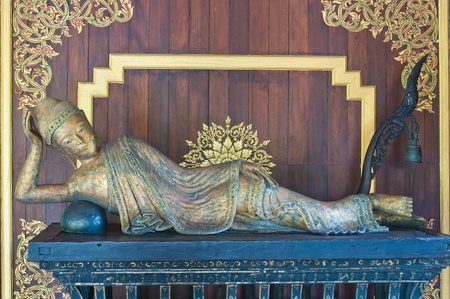 Reclining buddha made from wood, Thailand.の写真素材