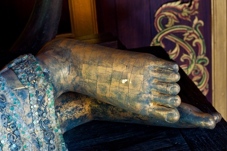 Foot of reclining buddha made from wood, Thailand.の写真素材