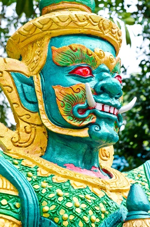 Green giant with golden dress, Thailand.の写真素材