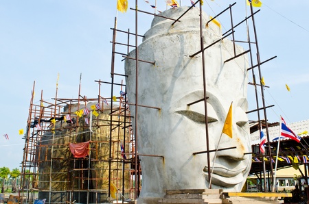 Face of buddha with blue sky, Thailand.のeditorial素材