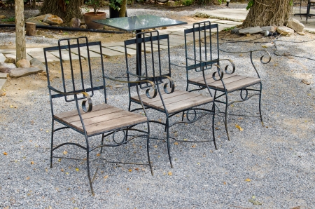 Three chairs on gravel floor, Thailand の写真素材