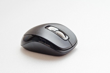 Black computer mouse on white screen, Thailand.の写真素材