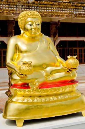 Phra Maha Kaccayana buddha statue with Thai church background, Thailand の写真素材