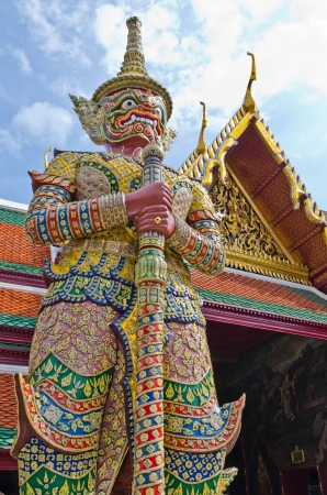 Red giant statue at Wat Phra Kaew temple, Thailand の写真素材