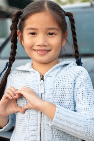 Portrait of the Thai beautiful girl in blue sweater suit, Thailand.の写真素材