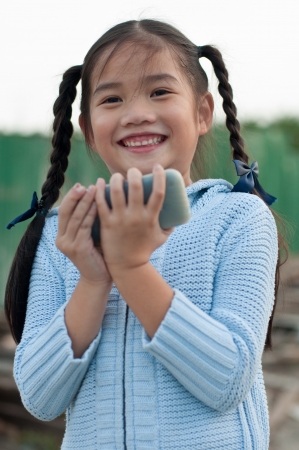 Portrait of the Thai beautiful girl in blue sweater suit, Thailand.の写真素材