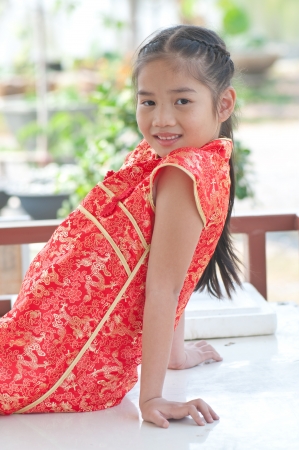 Portrait of oriental girl in Chinese style dress, Thailand.の写真素材