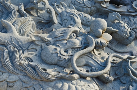 Dragon carving art on the wall, Thailand.の写真素材