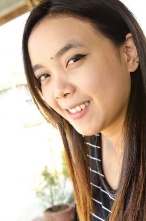 Portrait of beautiful Thai girl in black dress, Thailand.の写真素材