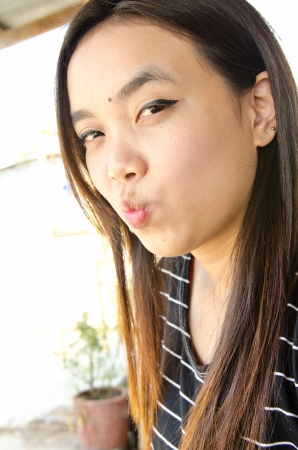Portrait of beautiful Thai girl in black dress, Thailand.の写真素材