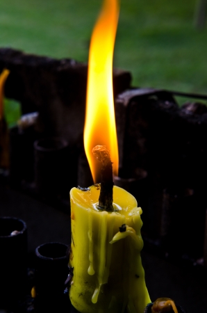 Close up of candle flame on black background, Thailand.の写真素材