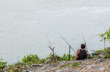 Fishing alone at Chaopraya river, Thailand.の写真素材