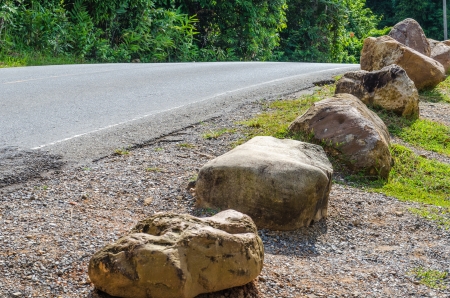Road and stone in national park, Thailand.の写真素材