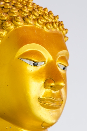Face of golden buddha statue at temple, Thailand.の写真素材