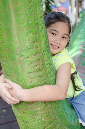 Portrait of asian girl in the park, Thailand.の写真素材