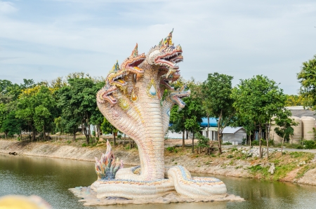 Beautiful Naga statue in water at the temple, Thailandの写真素材
