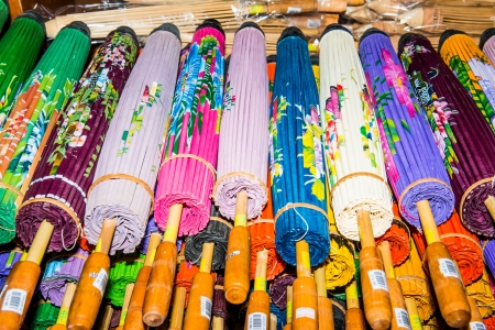 Thai style umbrellas in warehouse, Thailandの写真素材