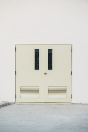 Steel door at factory building, Thailandの写真素材
