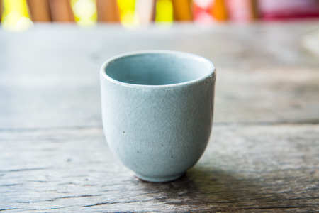 Ceramic white cup on wood table, Thailandの写真素材